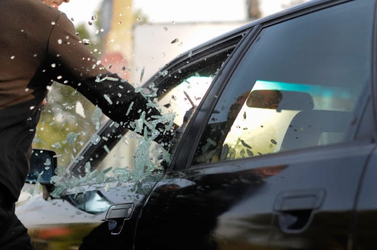 riot attack vandalize car window