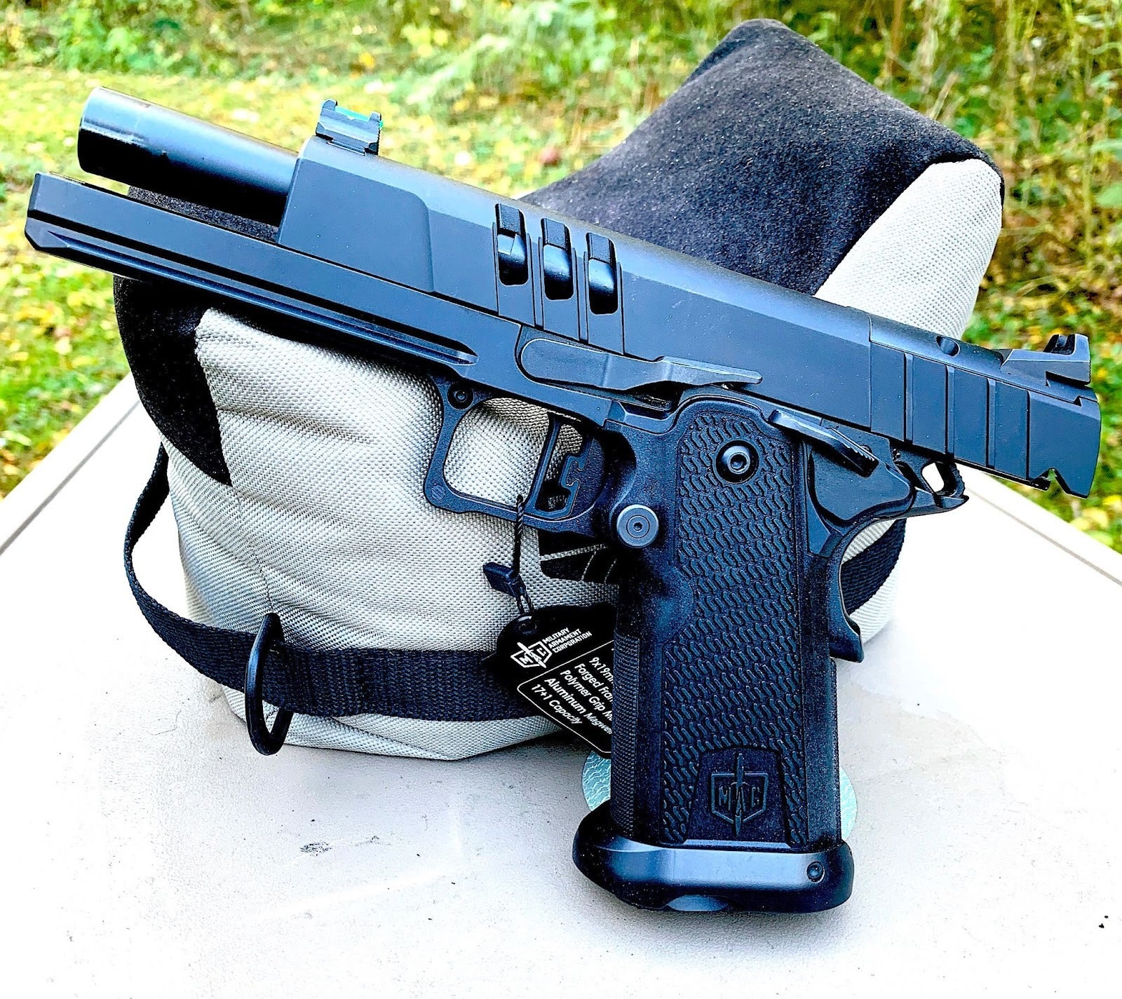 MAC 9 DS Duty — 5" 9mm 2011 on a gray bench, suppressor-height sights and aluminum magwell visible.