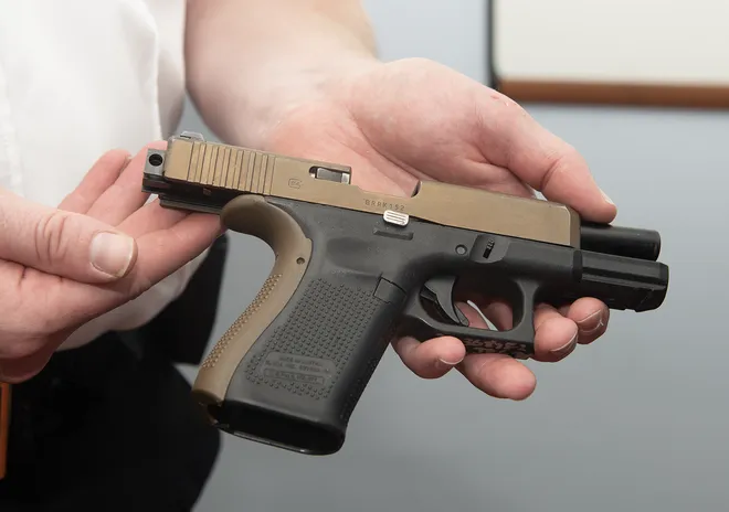 Glock pistol fitted with an illegal full-auto switch device seized by ATF