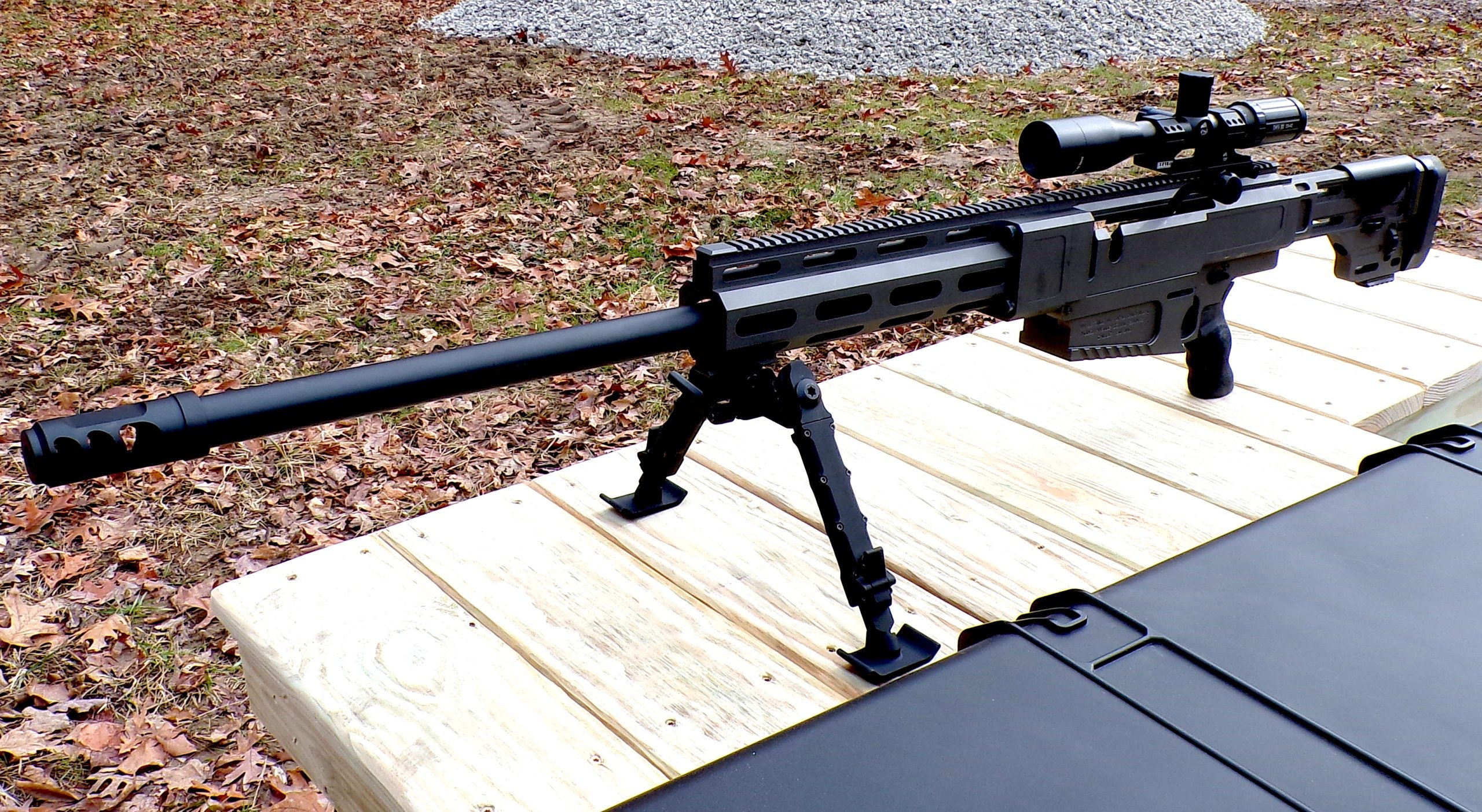 HM Defense .50 BMG rifle on the bench with hard case and bipod