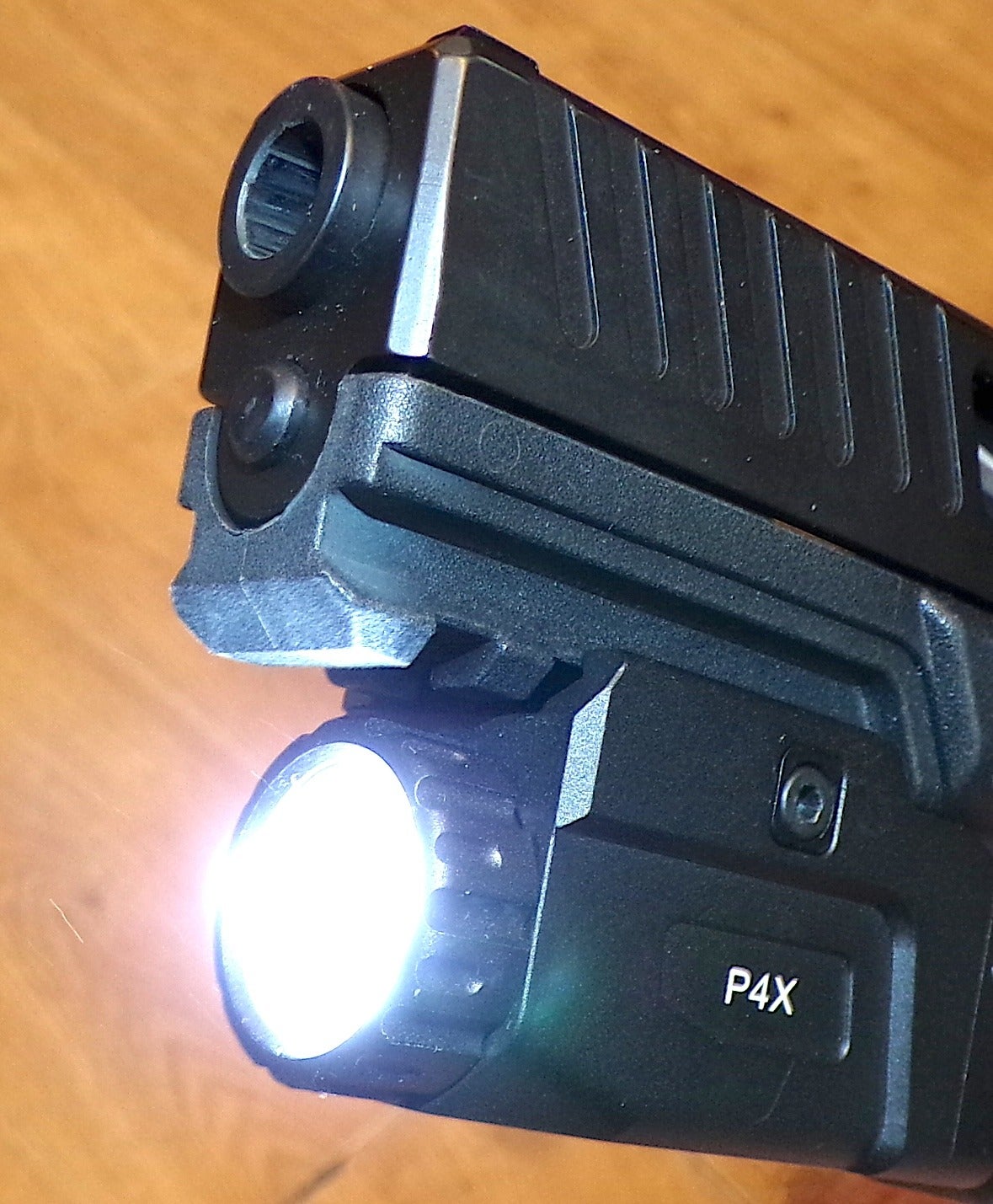 HiLight Tactical P4X pistol weapon light mounted on handgun rail
