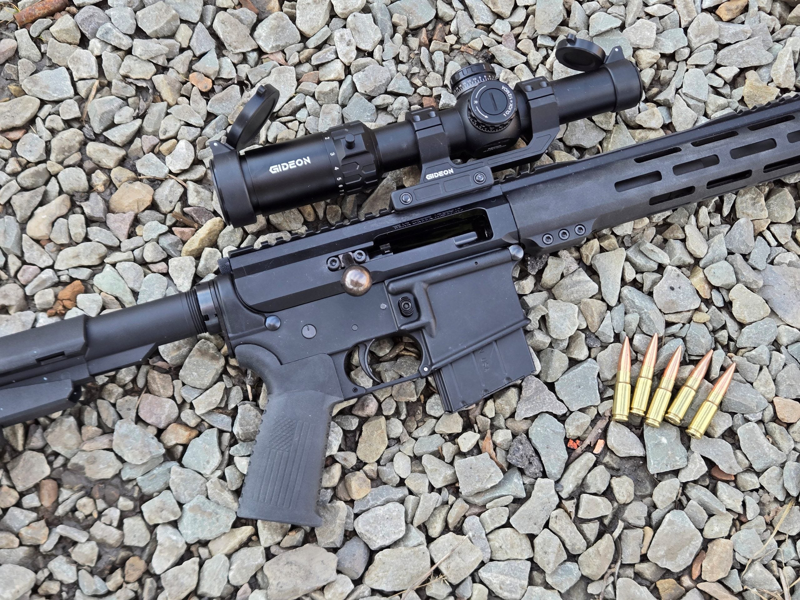 Bear Creek Arsenal BC-15 Pistol on the ground next to a few rounds of 338 ARC.