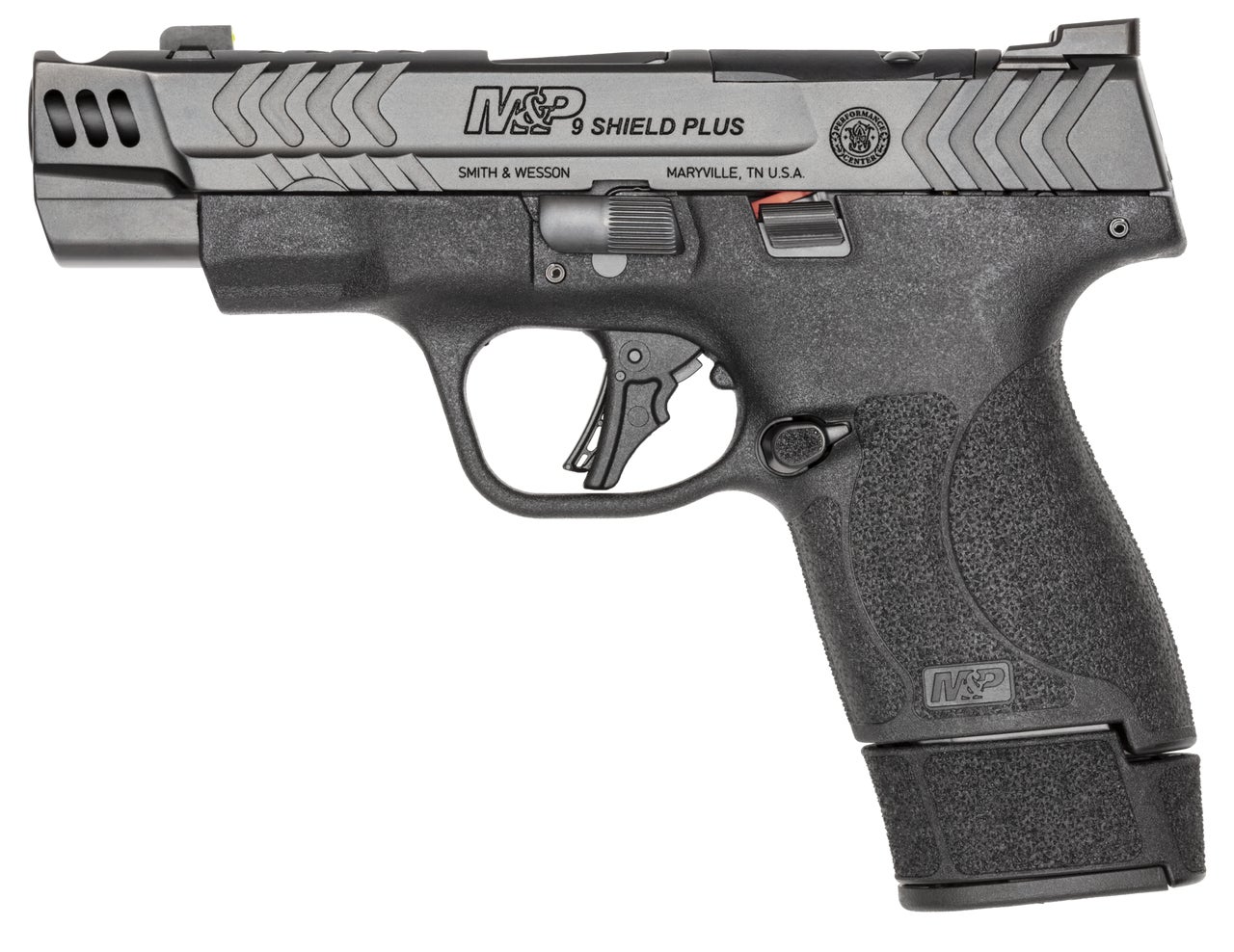 Close-up of the Shield Plus Carry Comp slide showing chevron cocking serrations and RMSC optics cut