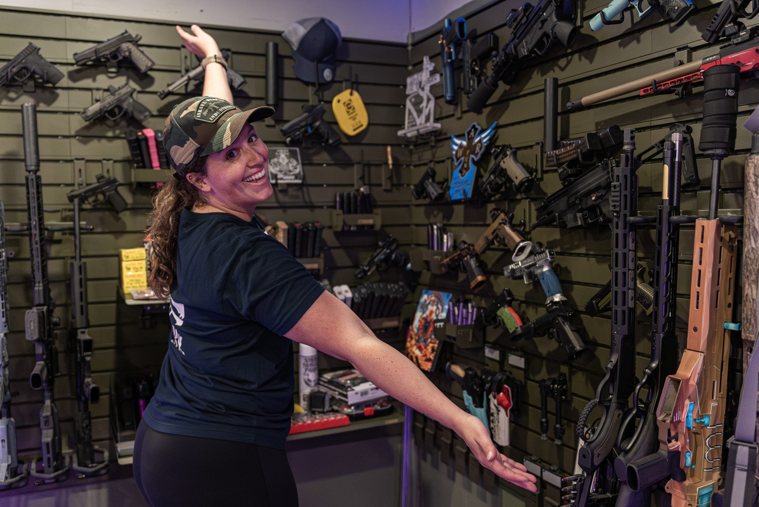 Savior Equipment Wall Rack System displaying rifles, magazines, suppressors, bipods and shooting gear in a gun room