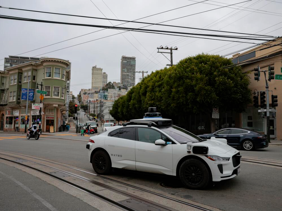 Waymo driverless robotaxi driving through San Francisco’s North Beach neighborhood
