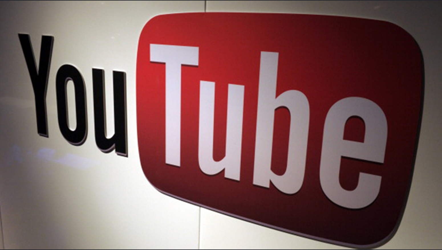 YouTube logo displayed on a wall