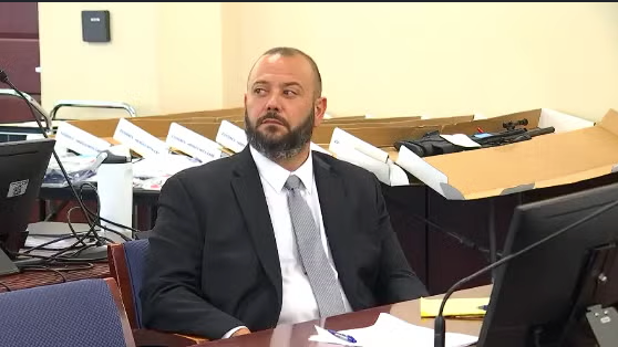 Demetrio Daga seated in an Albany courtroom